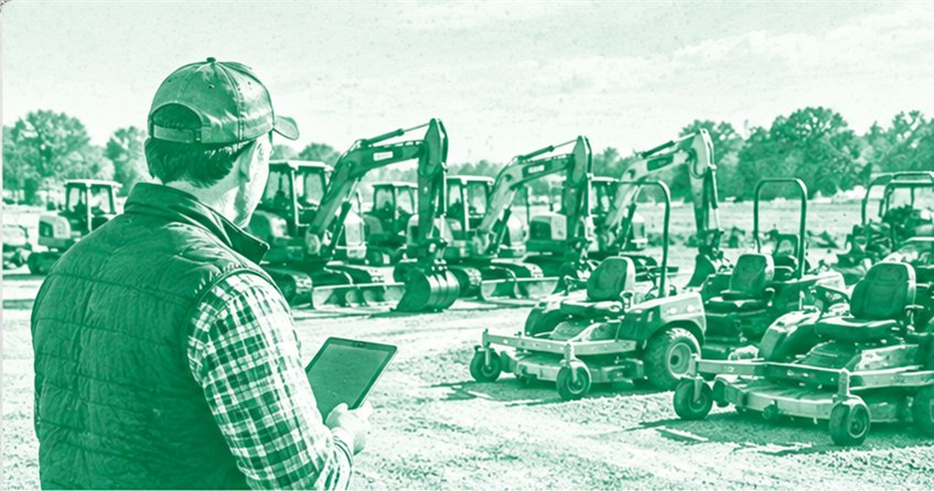 A dealer checking rental equipment on the dealership lot